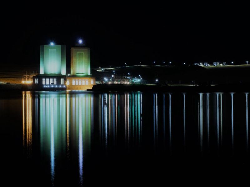 A view of the power houses at night.
