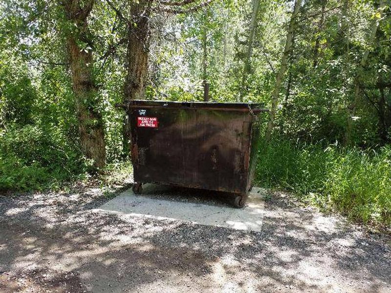 Big Game Campground trash dumpster, remember to pack out what you can!