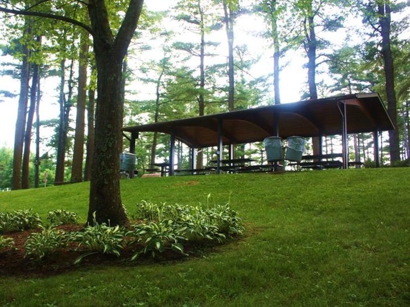 A view from the horseshoe pit looking at the Barre Falls Dam Picnic Shelter.