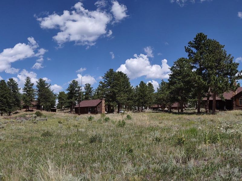 Redfeather Ranger Station Assistant Ranger Cabin, Office, and Ranger Cabin with Garage in Background.