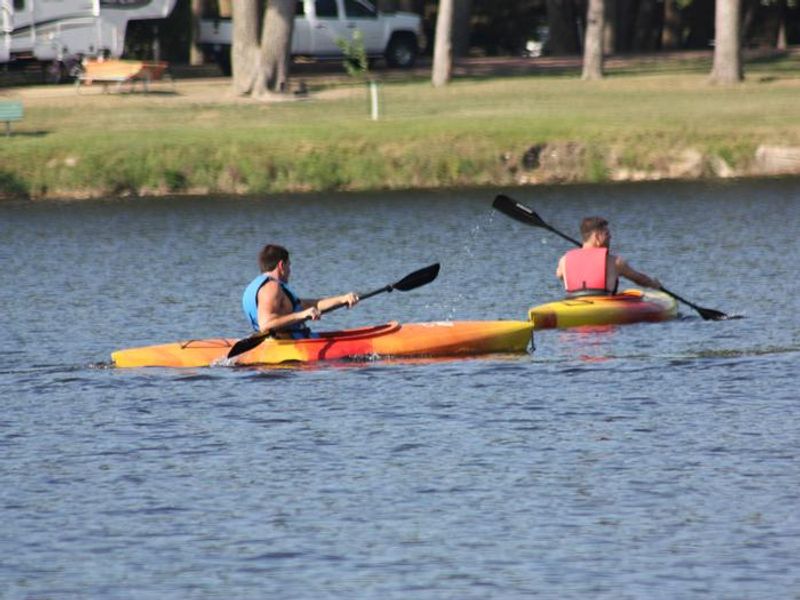 Kayaking on Lake Yankton with Cottonwood Campground in the background.