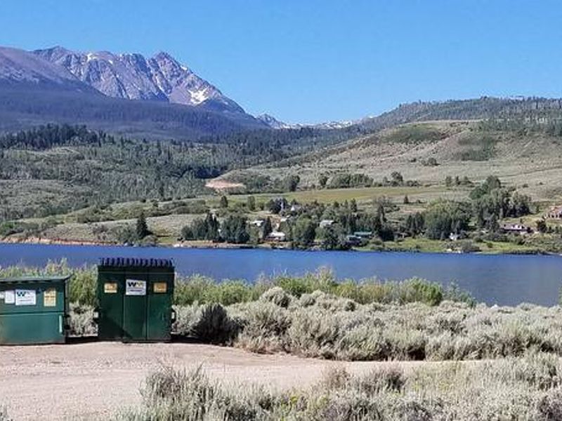 Cow Creek south sage field with reservoir and mountains in background