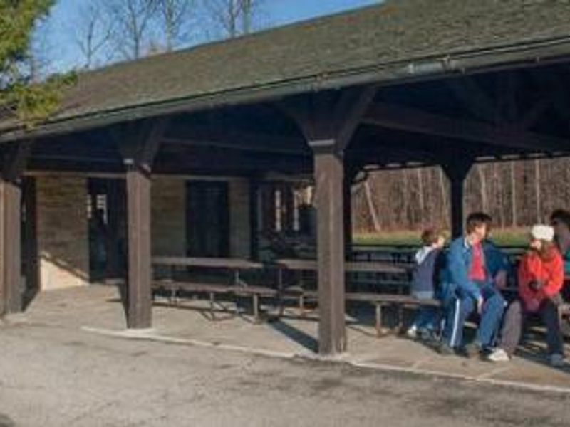 Visitors seated at a picnic table at the Ledges
