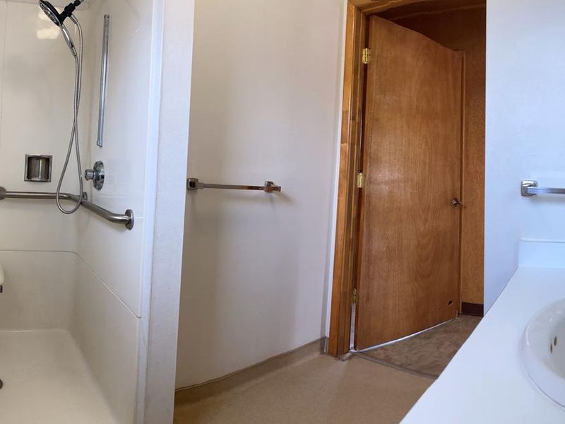 The accessible shower in Orange Olsen Dwelling.