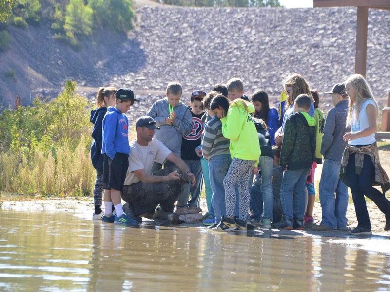Kids learning about different aquatic species and fossils during Jake's Day event