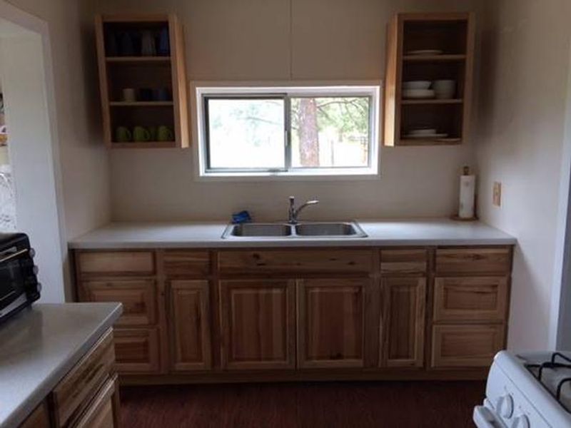 Full kitchen with gas range, microwave, toaster oven.