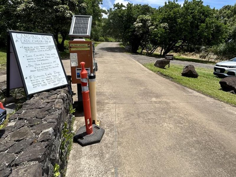Stop and check in with the entrance station staff. If you arrive after the station is closed, follow the information on the white display board located near the automated fee machine. 