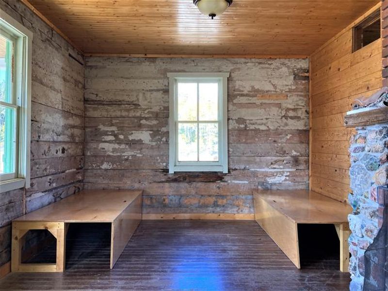 Cabin interior with folded out benches for added sleeping space.