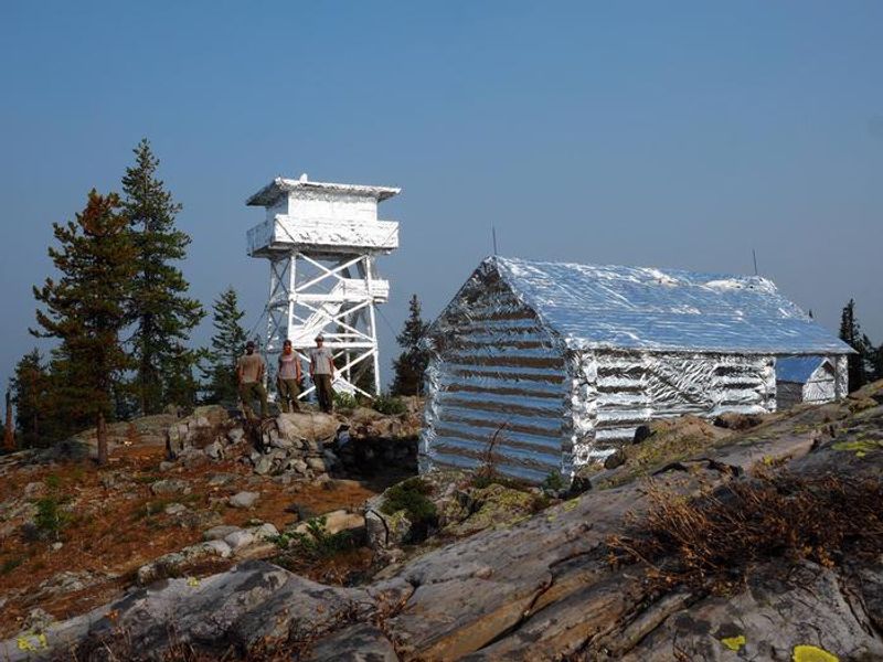 Lookout and cabin wrapped with fire resistant material for the Caribou Fire in 2018