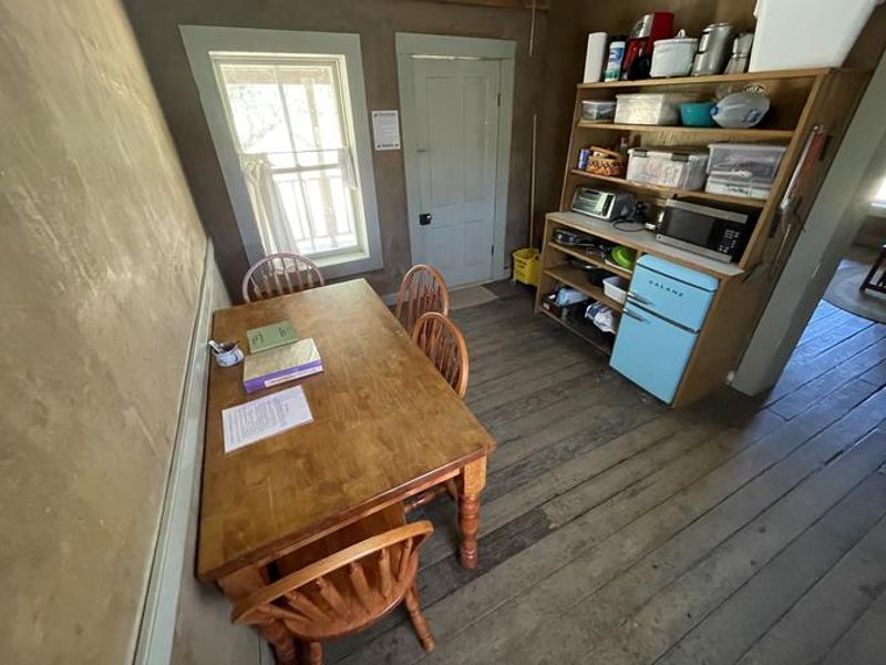 Kitchen of Kentucky Camp, outfitted with fridge, microwave, coffee maker, and toaster oven.