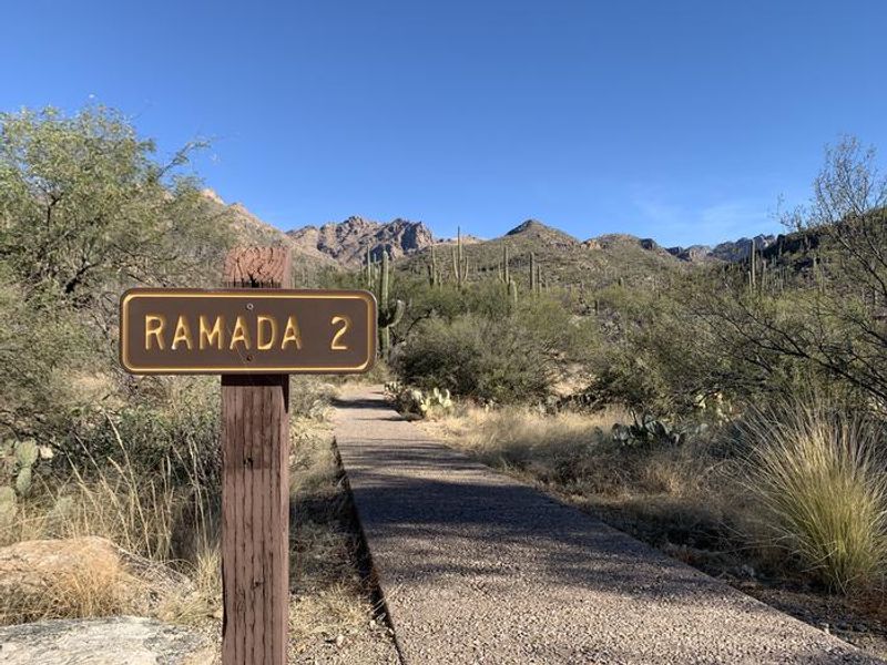 Entrance to Ramada 2 from gravel road.