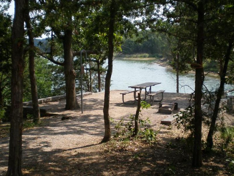 a lakeside campsite at The Point Campground