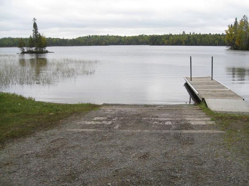 Birch Lake boatlanding, with dock and concrete boat ramp.