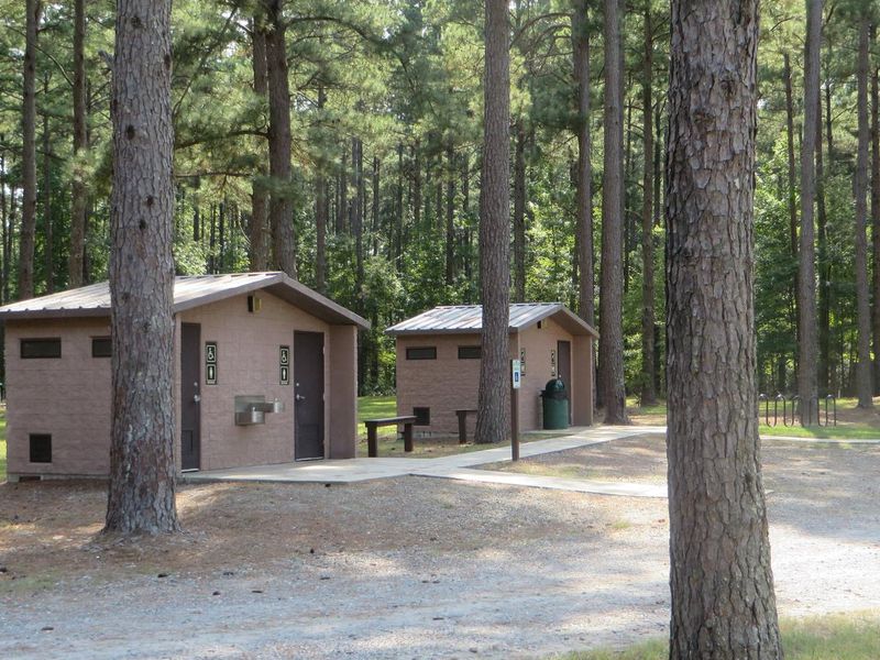 Bathrooms and Shower House. Flushing toilets, running water sinks, and drinking fountain amenities located within the comfort station. 