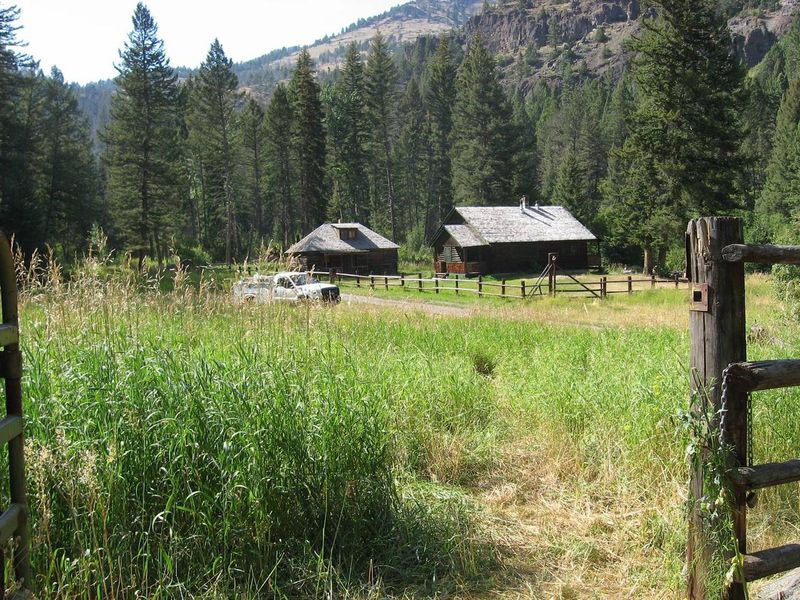 Across the meadow lies the cabin