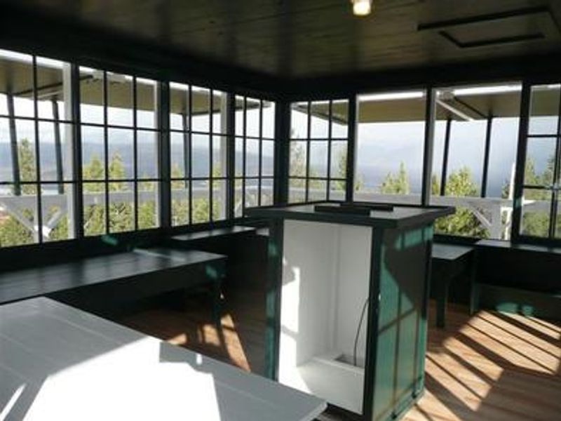 Double Arrow Lookout Tower- interior cabin looking northwest. Plenty of natural light shines through the windows, even on a cloudy day.