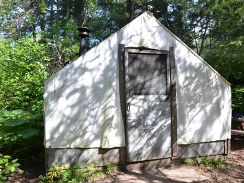 This canvas wall tent provides a warming shelter for hikers at Finnegan's Point