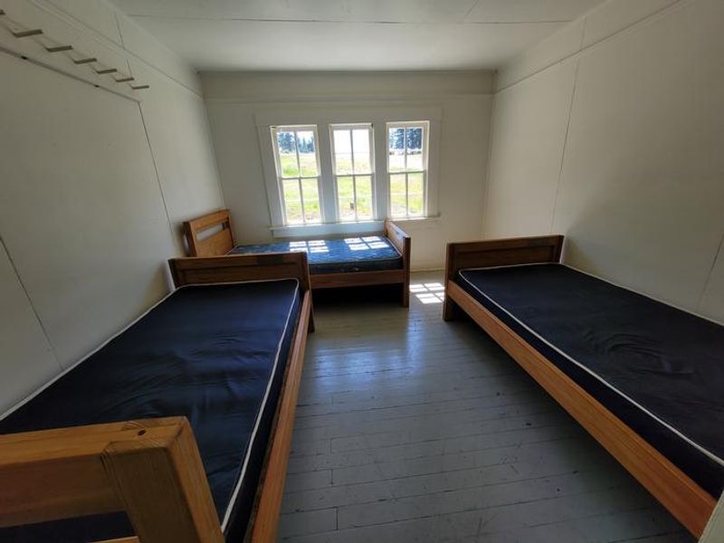 There are a total of 4 single beds upstairs