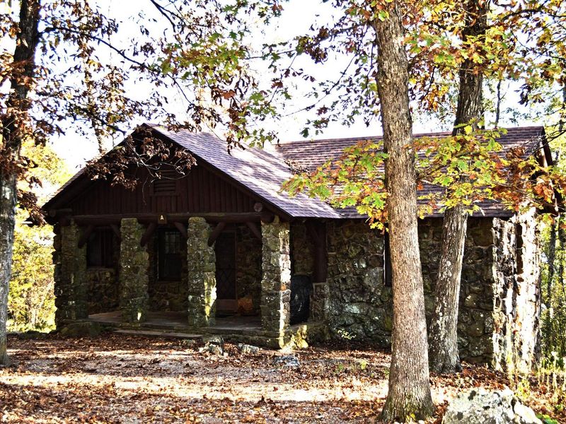 Cabin A features incredible stone work, two bedrooms, full amenities, and spectacular views!