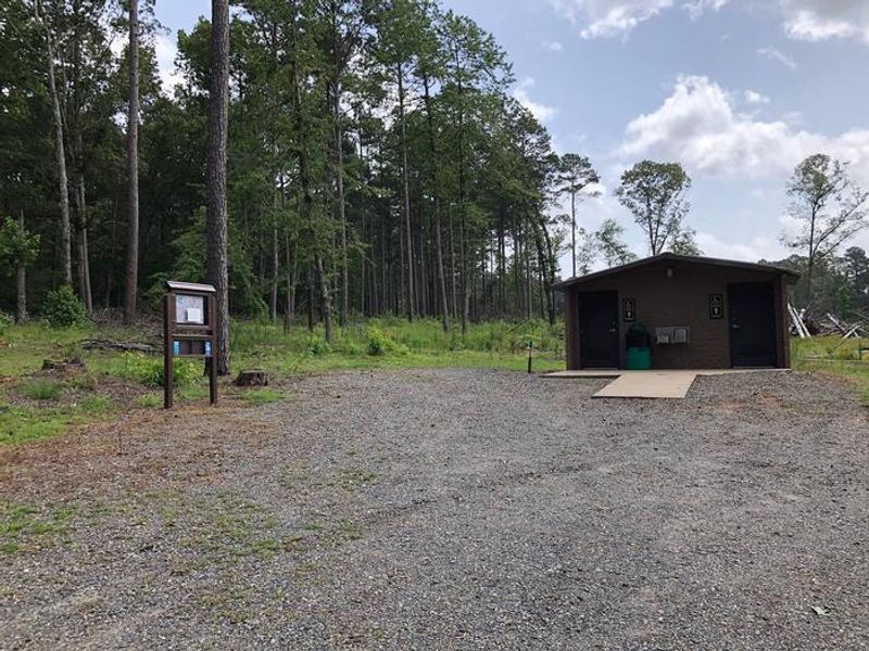 Flushing toilets, running water sinks, and drinking fountain amenities located within the comfort station. 