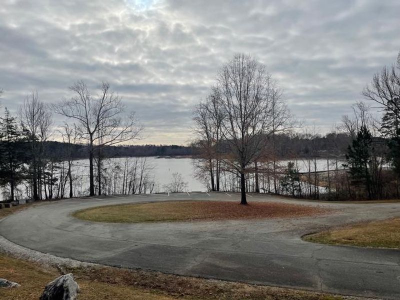 Welcome to Grassy Creek! Here is a view of the back parking lot. This lot has a few access points to the water for bank fishing. 