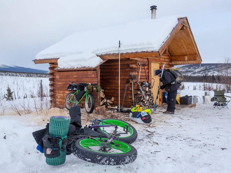 Bicyclists and skiers find cozy lodging at Cache Mountain Cabin.
