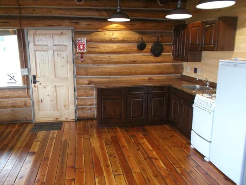 fridge and stove in kitchen 