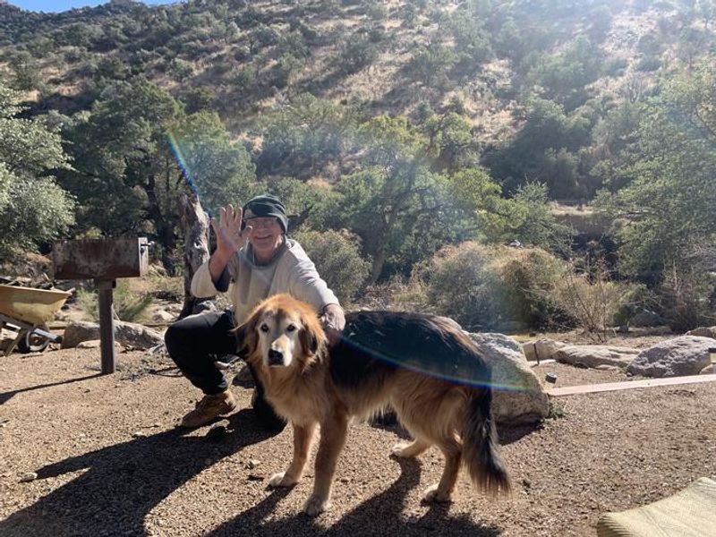 Wally the friendly camp ground host, with assistant Cyclone. He can answer your questions and help you find a campground!