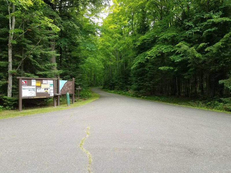 Lake Ottawa Campground entrance bulletin board and driveway.  Self-register fee tube located here.