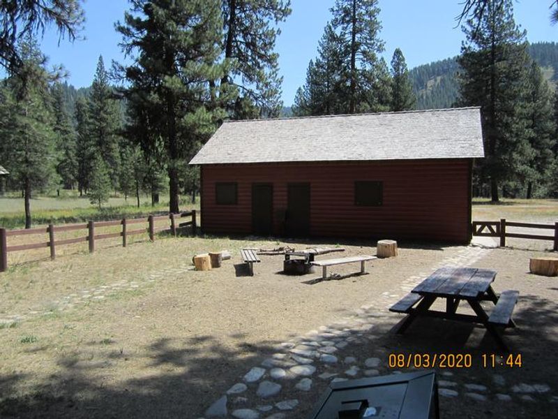Barber Flat features a large, flat yard with picnic tables and a campfire ring.  (Closed maintenance shed in background)