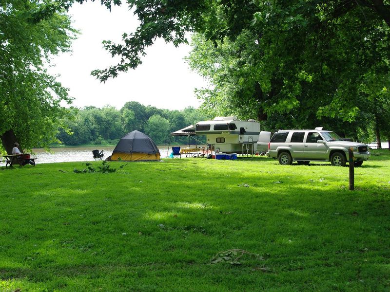 Popup Camper and Tent along river campsite