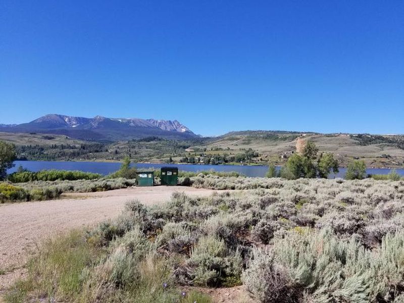 Cow Creek south sage field with reservoir and mountains in background