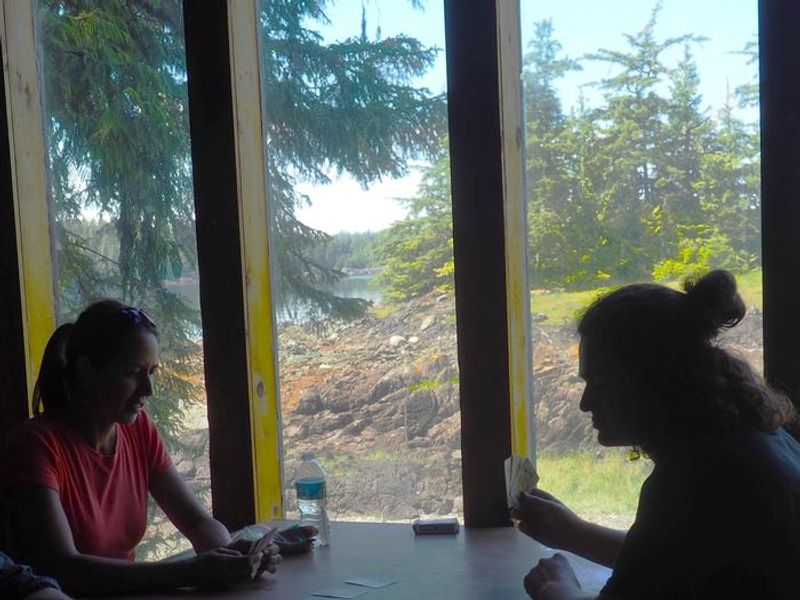 Enjoying the view while playing cards at Steamer Bay Cabin