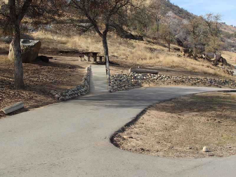 Pull Through driveway. From the gate first site on right. 