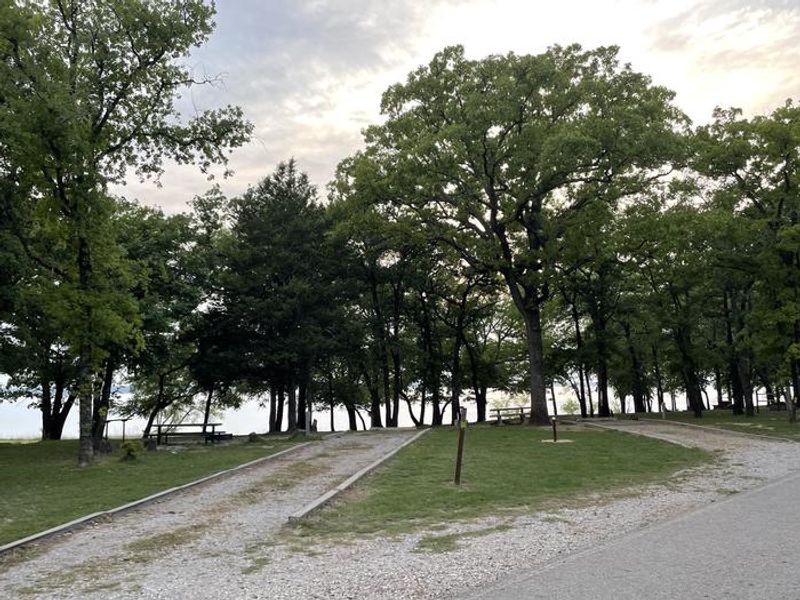 A photo of facility BURNS RUN WEST with Picnic Table, Electricity Hookup, Fire Pit, Shade, Waterfront, Water Hookup