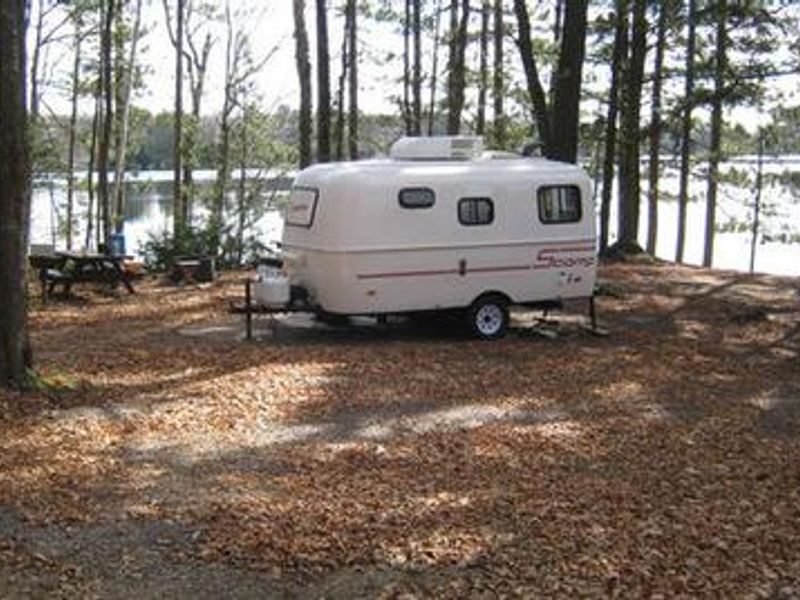 A camper with a view of the lake