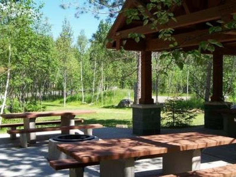 Group site shelter and tables.  Group sites also include electrical hook-ups, designated parking areas, tent pads, access to the lake, and fire rings.