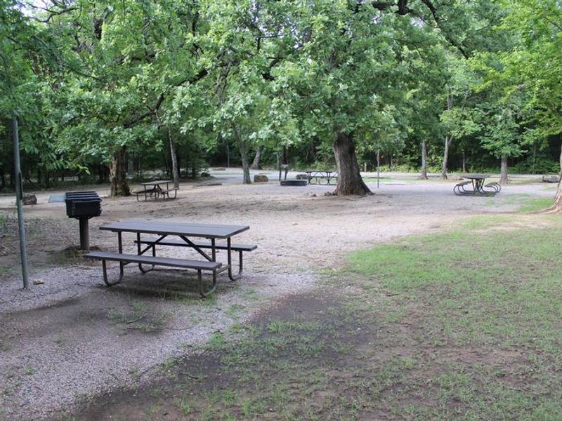 A picnic table and grill at the the Rock Creek Campground group site