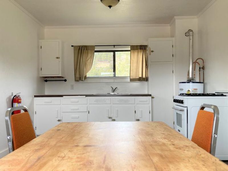The dining table sits in the kitchen of Orange Olsen Cabin.