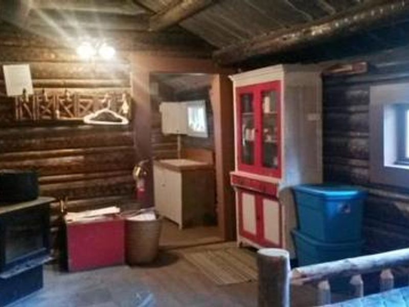 View of the woods stove and kitchen 