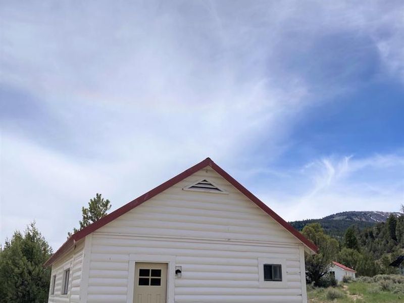 Orange Olsen Cabin lays down the hill from Orange Olsen Dwelling.