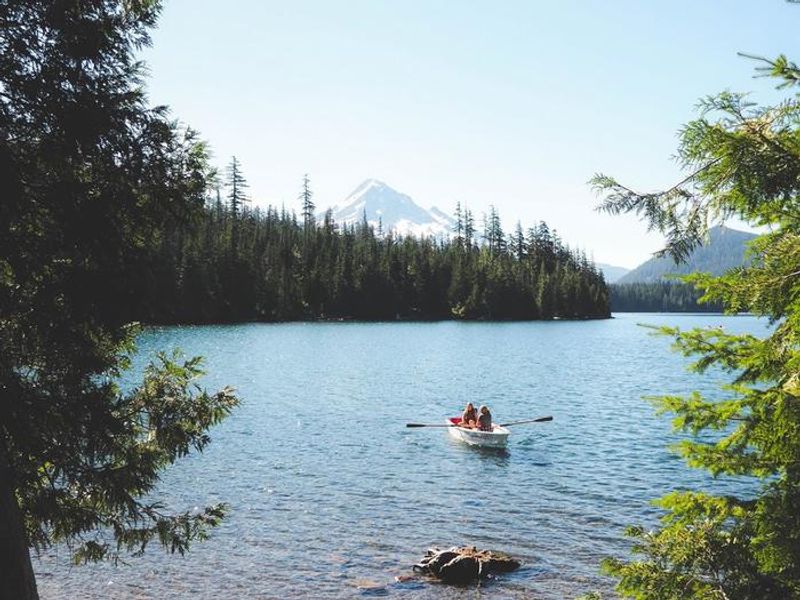 Enjoy a boat ride around Lost Lake in one of our many rental boats, like these historic red and white rowboats. 