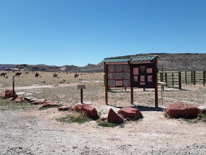 Courthouse Rock equestrian facilities with silhouette pack string in the background