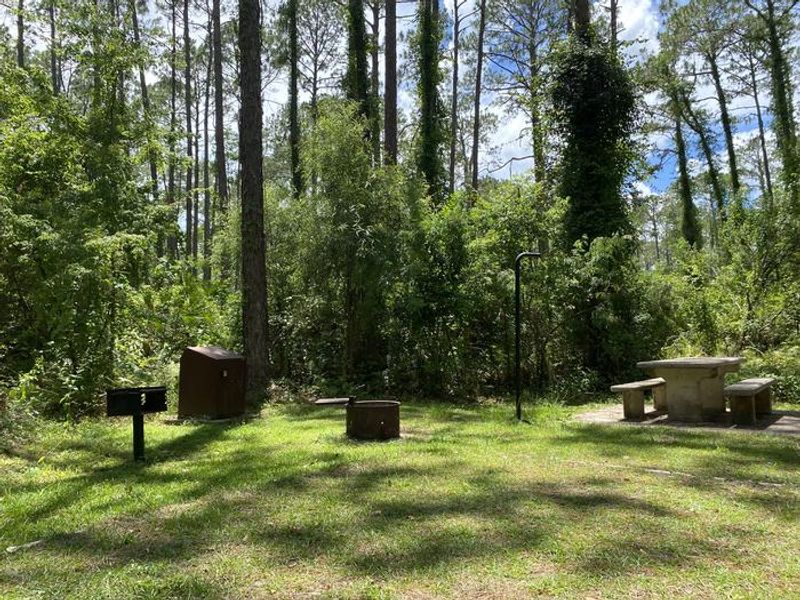 A photo of facility Lake Dorr Campground with Picnic Table, Fire Pit, Shade, Food Storage, Tent Pad, Lantern Pole