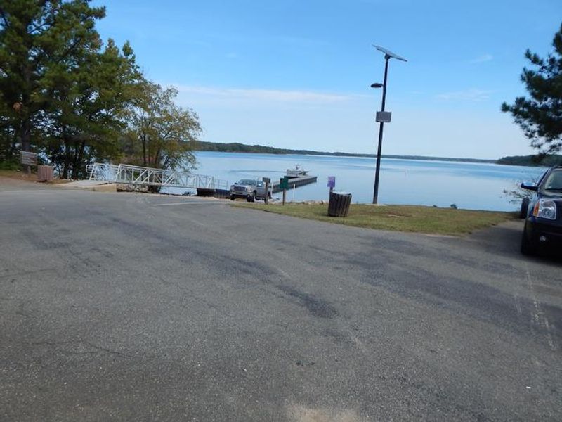  This is a photo of the boat ramp at Ivy Hill Park. There is ample amounts of parking available to park trucks with boat trailers. 