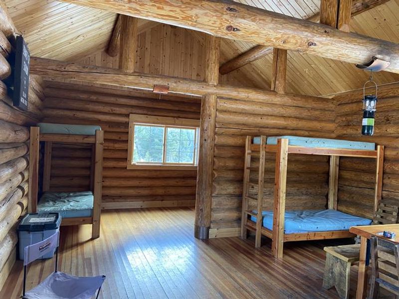 Interior of Crandall Cabin showing beds and spacious room