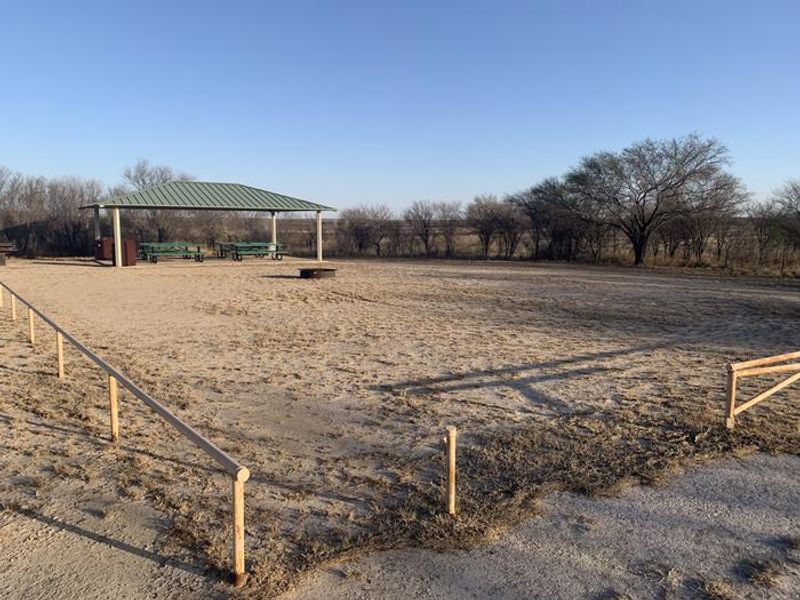 The group picnic shelter and fire pit area