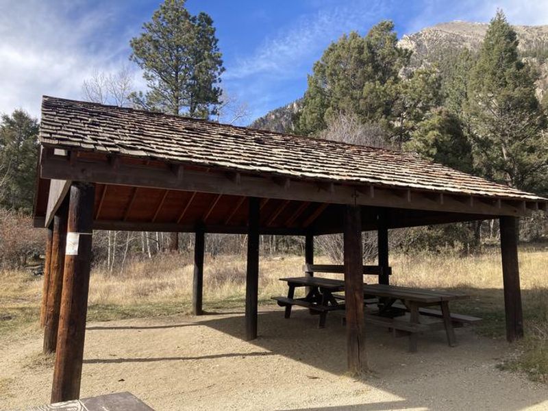 Wooden pavilion with picnic tables