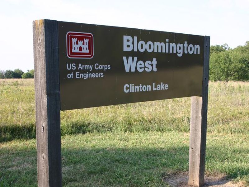 Bloomington West Park offers a day use with a boat ramp and restroom as well as a spacious group campground that sits under an umbrella of trees west of Clinton Dam and Lake in the hills of Kansas. This group site offers 25 individual sites, four with 20/30 Amp electric and water connections. This area has a total capacity of 150 guests. A boat ramp is located within a mile of the site, and grills, flush toilets, showers and drinking water provide a comfortable camping experience.