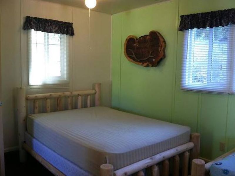 Cabins are single rooms with closets. Cabins 1 - 6 have 3 beds. Cabin 7 has 1 bed.  All cabins have electric space heaters. Cabins 1 - 6 have wood stoves. Cabin 7 has an electric fireplace. Cabins are neat and orderly and have themed decor. 